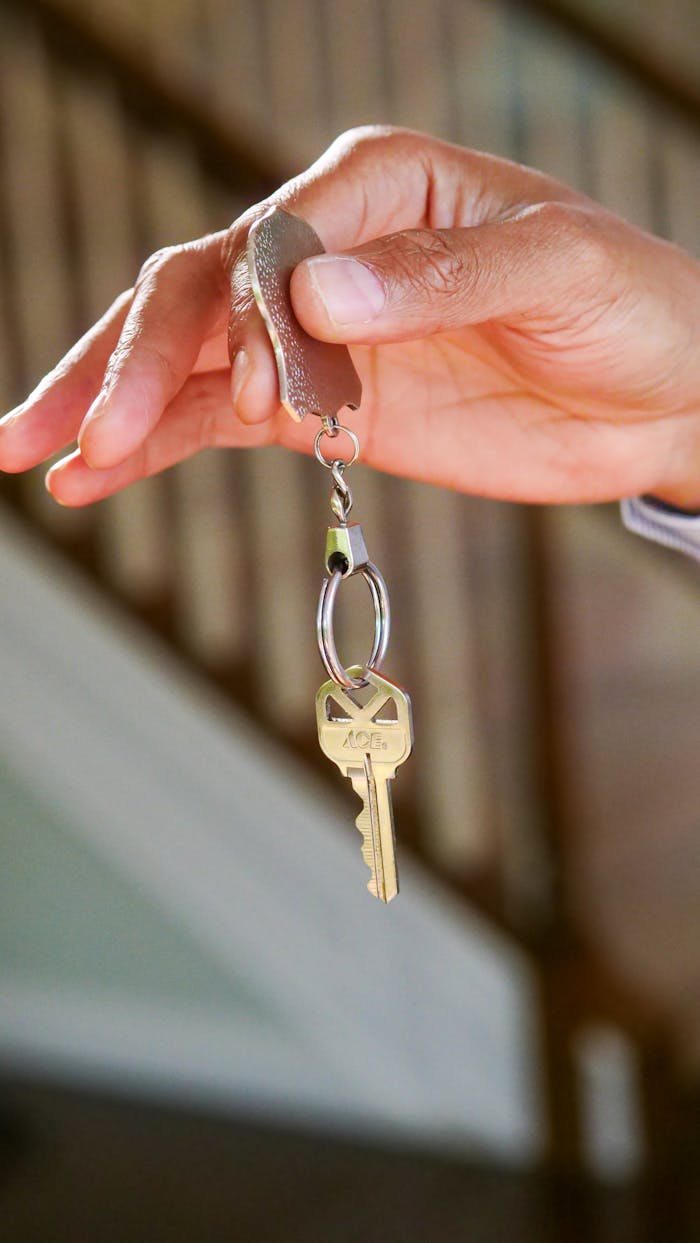 Crafting Captivating Headlines: Your awesome post title goes here Close-up of a hand holding a key, symbolizing new homeownership or rental.